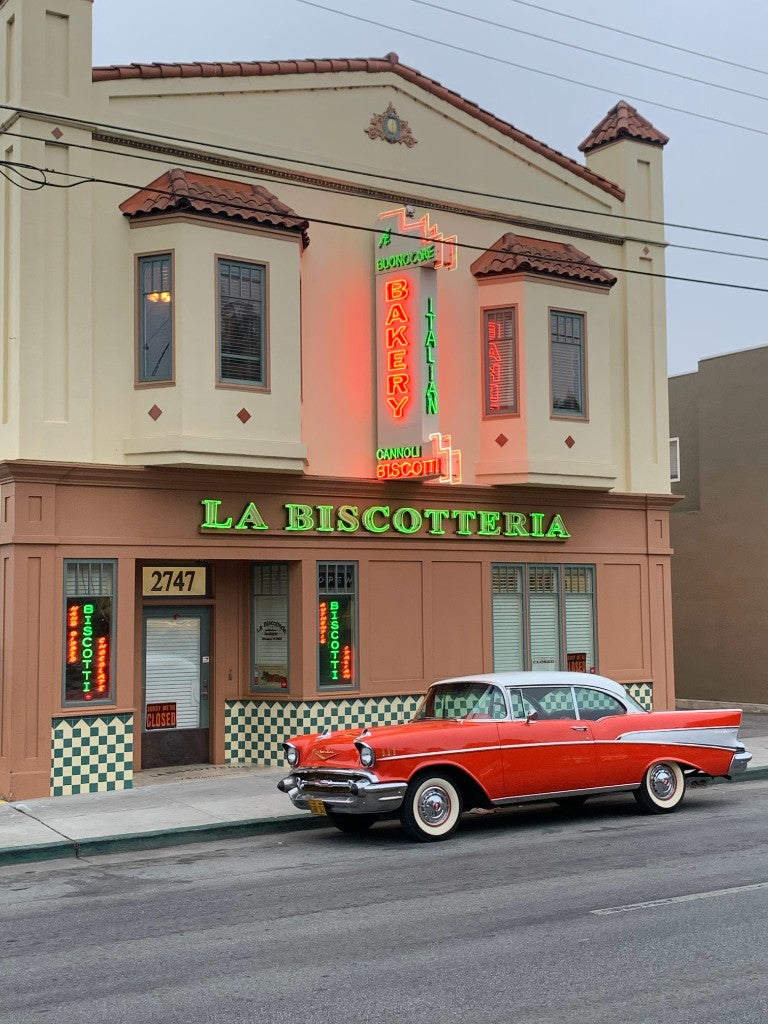 La Biscotteria bakery storefront at night with neon sign in Redwood City